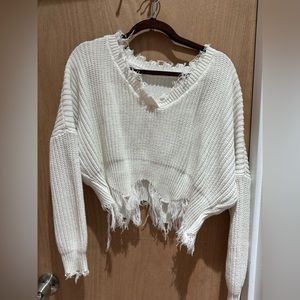 Distressed white sweater